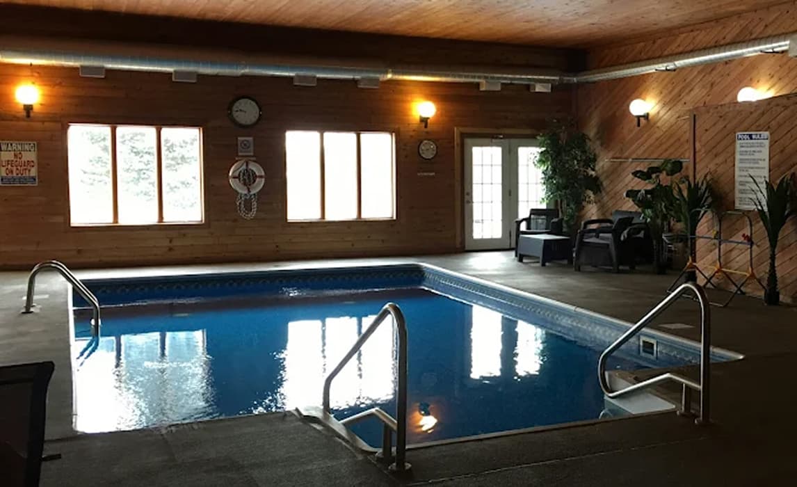 Contemporary bedroom with glass bathroom